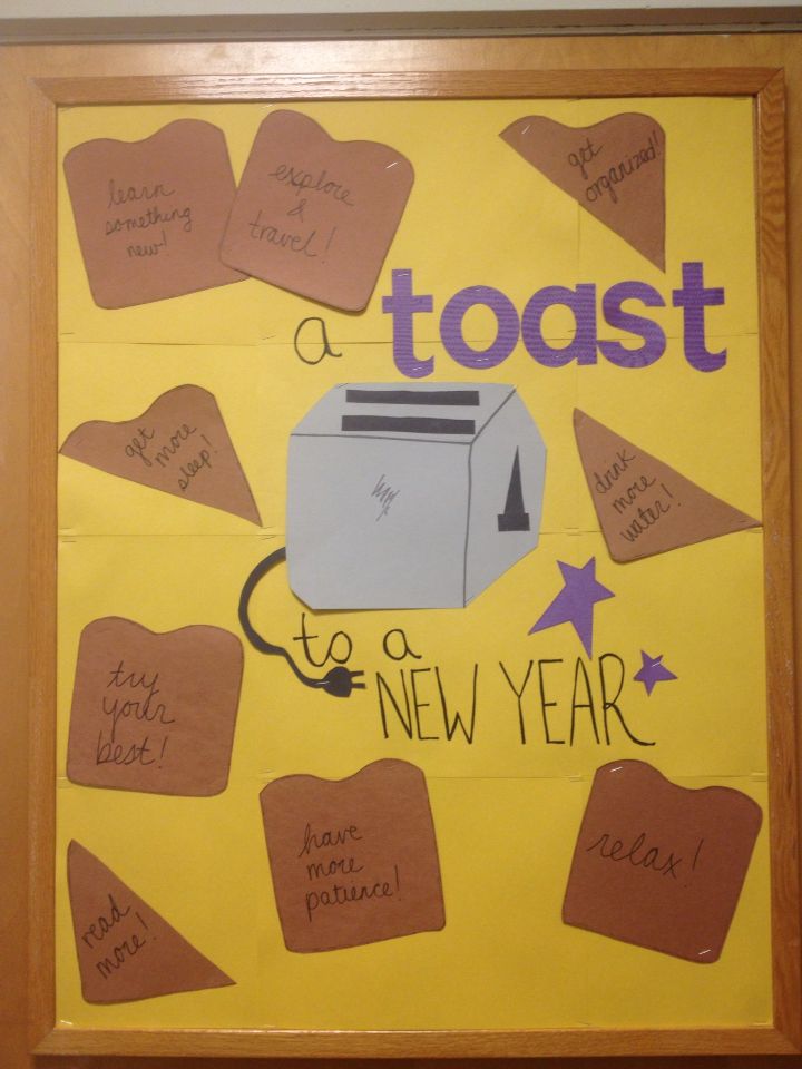 a bulletin board with toaster and new year's message written on the side