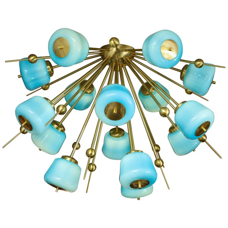 a chandelier with blue glass shades and gold metal rods in the middle, on a white background