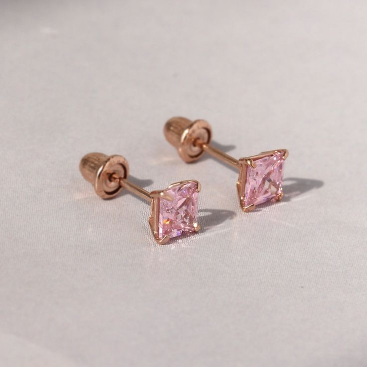 SKU : DJBSQ4010 This 14K Yellow Gold Pink Cubic Zirconia Basket Set Solitaire Cartilage Stud Earrings is a meticulously crafted and beautiful earring. Specifications Metal color: 14K Yellow Gold Dimensions: Available in 4 mm, and 5 mm Stone Shape: Princess Stone Color: Pink Material: Solid 14K Gold Our stones are the highest quality diamond simulants that are polished, finely cut, loupe clean, and have an exactly similar appearance and as beautiful as to naturally occurring diamonds. All cubic zirconia stone weights are approximate and listed as diamond equivalent weight in carats. All jewelry is new and inspected for quality assurance. Ships from the United States to ensure quality, reliability, and punctuality.