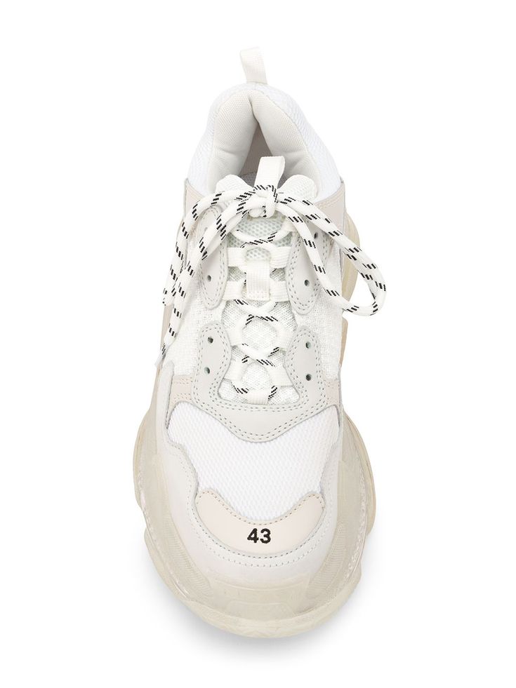 White leather Triple S bubble sneakers from Balenciaga featuring a front lace up detail, a cushioned air sole, branded detailing to the sides, a pull tab at the rear and three layered soles. | Balenciaga Triple S bubble sneakers Designer Low-top Sneakers With Laces, Luxury Lace-up High-top Sneakers With Translucent Outsole, Designer Lace-up Sneakers With Rubber Sole, Mesh Sneakers With Contrast Sole, White Mesh Lace-up Sneakers, Designer Sneakers With Laces, Designer Sneakers With White Sole And Laces, Designer Platform Sneakers For Streetwear, White Low-top Chunky Sneakers With Perforations