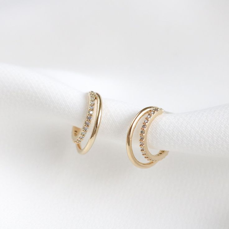 The Pari earrings feature paved crystals on the inner hoop, layered with a smooth hoop. Size: 15mm, paired with a smaller 12mm huggie (Approx.) Main material:   - 16k Gold/ Rose Gold/ Rhodium Plated, Brass,  - 92.5 Sterling Silver Post -  Cubic Zirconia --------------------------------------------------- Instagram Follow us @statementgrey Bridesmaids Earrings , Wedding Earrings, Pretty Earrings, Bridal Earrings, Bridal Jewelry, Bridesmaids Gifts Small Hoop Earrings For Wedding, Small Hoop Pierced Earrings For Wedding, Small Hoop Jewelry With Diamond Accents For Wedding, Elegant Hoop Wrap Earrings For Anniversary, Small Hoop Wedding Jewelry With Diamond Accents, Small Hoop Diamond Earrings With Accents For Wedding, Pierced Hoop Earrings For Wedding, Huggie Earrings For Wedding, Pierced Ears, Huggie Earrings For Wedding