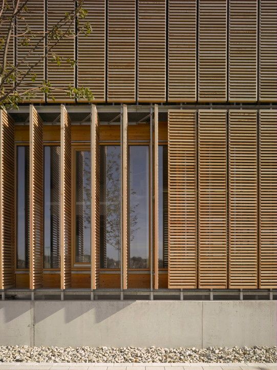 the side of a building with wooden slats on it