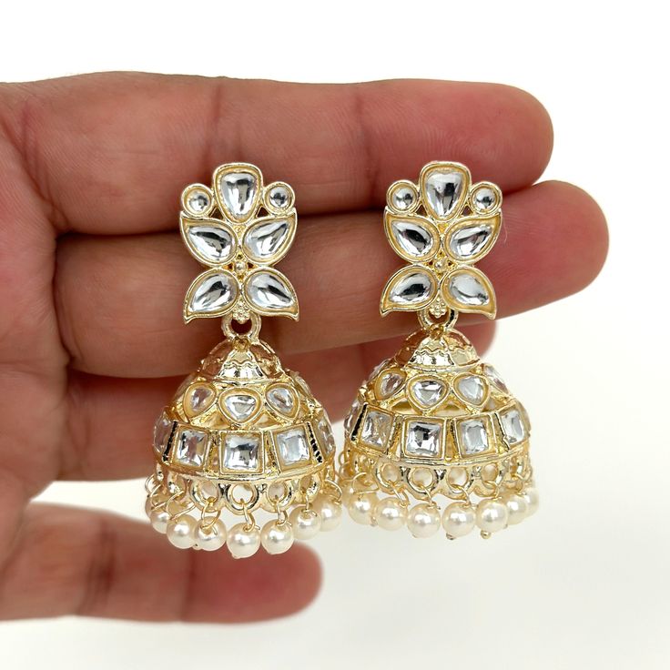 Small Light weight kundan Jhumka/kundan Jhumka/Indian Jewelry/Pakistani/Punjabi/Indian/Statement earring/Bridal earring/Indian wedding Lightweight and elegant  Style 1 Height = 48 mm || Width = 17 mm Style 2 Height = 44 mm || Width = 27 mm Pearl Jhumki Indo Western Earring Can be paired with any dress Closure: Pushback This is 100% Handmade jewelry. So Color, shades, texture displayed may slightly vary from the actual product due to digital image limitations. We request you to consider these min Heavy Earrings For Wedding And Navratri, Festive Bollywood Jhumkas With Stone Work, Bollywood Style Stone Work Jhumkas For Festive Season, Bollywood Style Festive Jhumkas With Stone Work, Party Kundan Jhumkas With Stone Work, Kundan Jhumkas With Stone Work For Parties, Festive Kundan Jhumkas For Wedding, Kundan Jhumkas With Stone Work For Wedding, Kundan Bridal Earrings With Tilla For Navratri