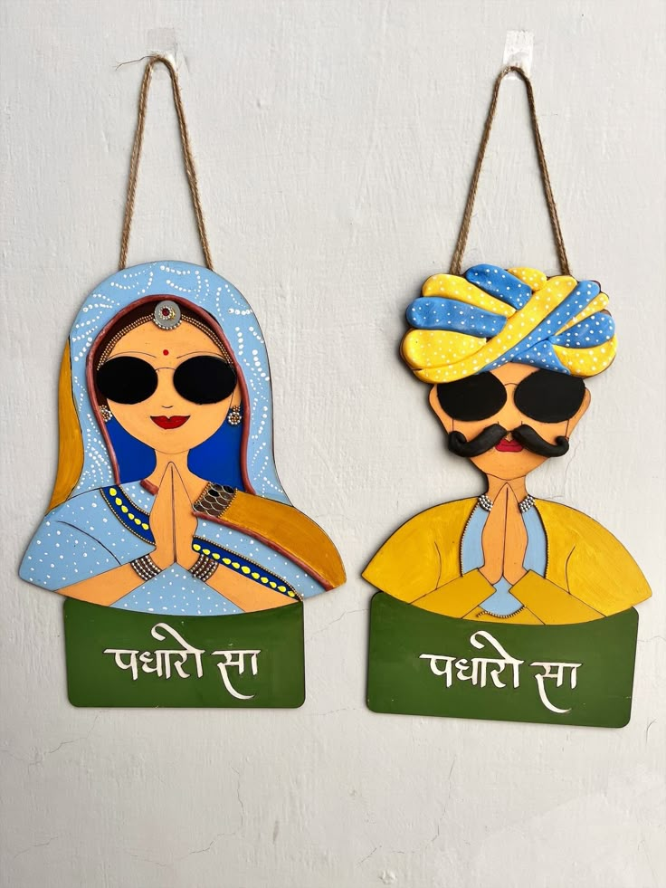 The Handmade Hand-Painted and Clay Work Padharo Sa stylish men and Women Wall Hanging Wooden Hand-painted Decorative Showpiece is a beautiful and unique piece of art that will add charm to any room it is placed in. This decorative showpiece is crafted with a lot of care and attention to detail by skilled artisans who use traditional techniques to create this masterpiece. The showpiece is made of high-quality wood that has been carved and painted by hand to create a beautiful, intricate design. T Paintings To Decorate Wall, Art For Decoration Home Decor, Wooden Wall Hangings Home Decor, Rajasthani Couple Painting, Show Pieces Decor Handmade, Padharo Sa Decor, Wall Hanging With Clay, Welcome Painting Wall Art, Cardboard Crafts Diy Wall Art Hanging