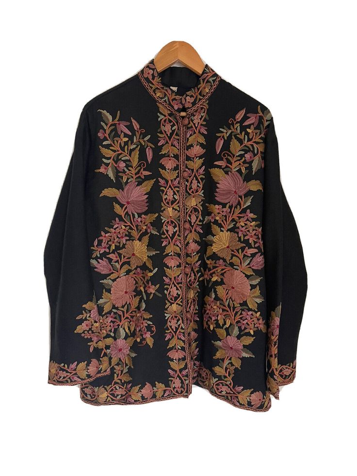 Gorgeous statement floral embroidered wool coat with mandarin collar and buttons. Detailing on front, back, and cuffs. Lightweight. Never worn-new with tags. Embroidered Stand Collar Top For Fall, Fall Embroidered Top With Stand Collar, Traditional Black Outerwear With Chikankari Embroidery, Festive Black Spring Outerwear, Fall Floral Embroidery Tops With Stand Collar, Traditional Black Top For Fall, Spring Outerwear With Resham Embroidery, Multicolor Embroidered Outerwear With Stand Collar For Fall, Black Embroidered Long Sleeve Outerwear