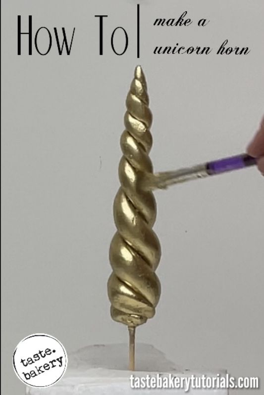 a person is painting gold spirals on a piece of paper with the words how to make an unicorn horn