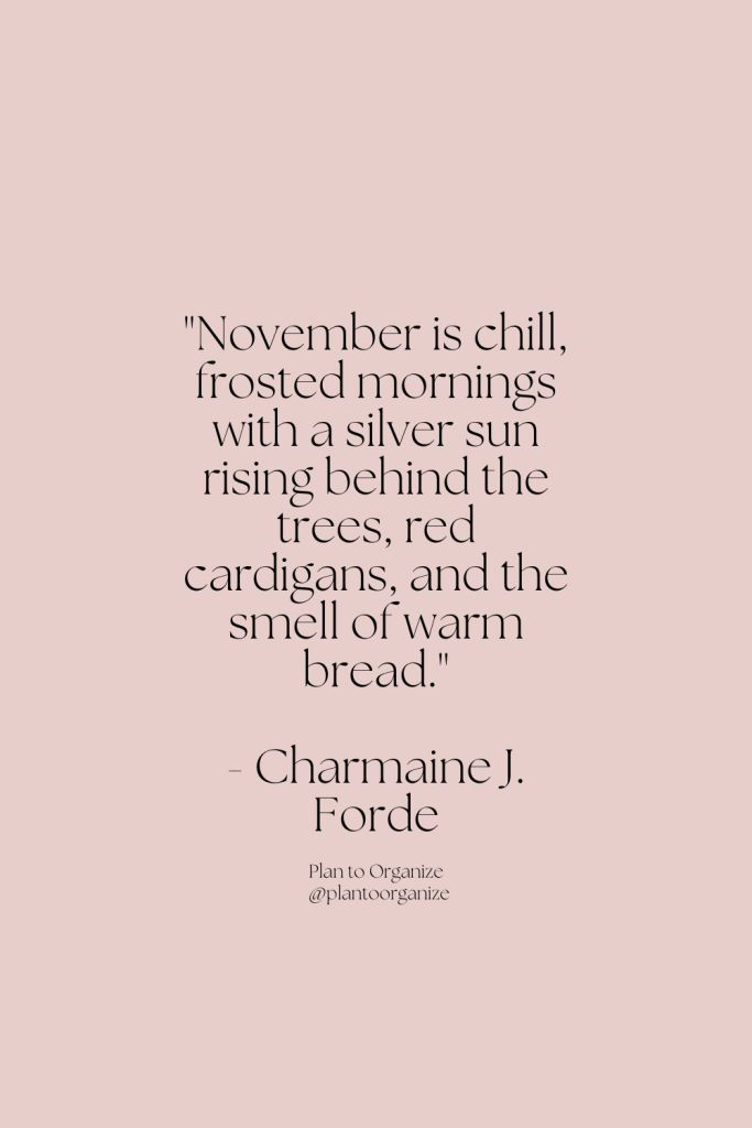 a pink background with the quote november is chill, frosted mornings with a silver sun rising behind the trees, red candles, and the smell of warm bread bread