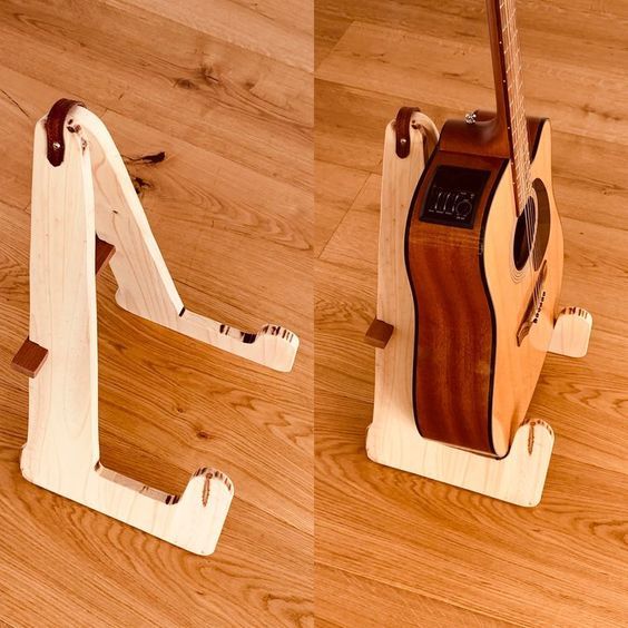 a guitar stand made out of wood on the floor