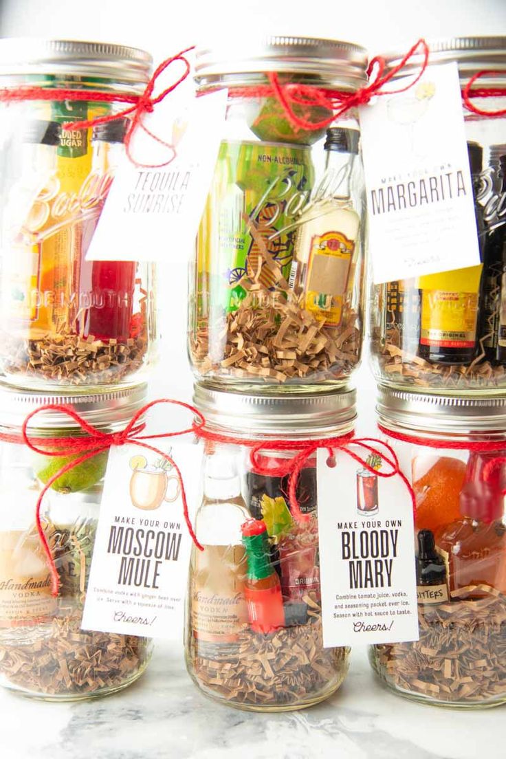 four mason jars filled with different types of items