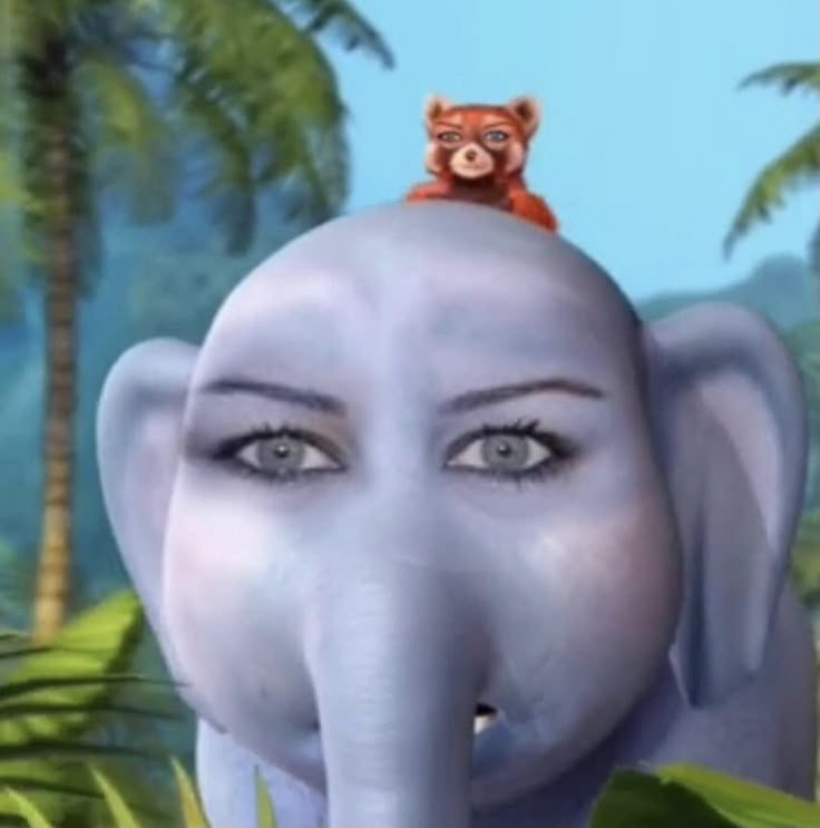 an elephant with a bear on top of it's head in front of palm trees