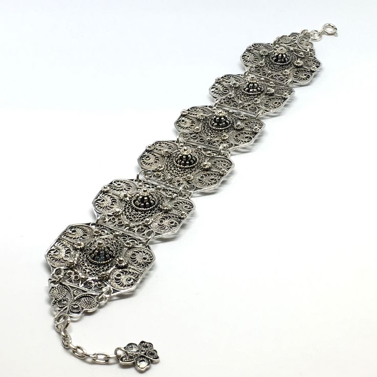 This bracelet is part of our Premium Master Collection. The bracelet was made by one of our family's master jewelers.  The entire bracelet is hand made with filigree techniques used by old filigree masters. The material used is sterling silver (925) and fine sliver (999). Creating this particular bracelet required patience, extensive work, creativity and it is one of the unique pieces amongst all of our collections. This bracelet reminds us of endurance, patience and delicateness. Bracelet Lengt Elegant Oxidized Metal Cuff Bracelet, Elegant Metal Cuff Bracelet With Oxidized Finish, Silver Oxidized Wedding Bracelets, Metal Bangle Bracelet With Intricate Design, Silver Bracelets With Oxidized Finish For Weddings, Silver Wedding Bracelets With Oxidized Finish, Wedding Metal Bracelets With Filigree, Wedding Metal Bracelets With Filigree Details, Wedding Bracelets With Filigree Metal