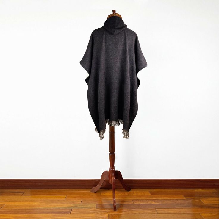 This is a handmade unisex poncho, made of alpaca wool yarn. It is light although is warm, very soft to touch and won't itch. One Size (approx.): 46" x 43" / 116 cm W x 108 cm H incl. fringe Material: Alpaca Wool blend Colour/pattern could vary slightly from the photo. Weight of each item (approx.): 750 g / 1.65 lbs Care: Hand Wash Use Mild Detergent Do not Bleach Black Alpaca Shawl Poncho, Black Alpaca Poncho For Winter, Brown Alpaca Cape Poncho, Brown Alpaca Poncho Cape, Black Alpaca Cape For Winter, Winter Alpaca Poncho Cape, Winter Alpaca Cape Poncho, Alpaca Shawl Outerwear For Winter, Cozy Brown Alpaca Poncho