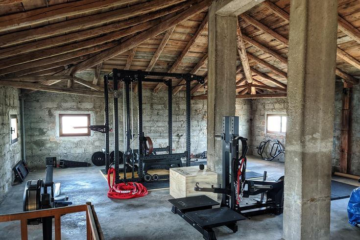 the inside of a building with several different machines and equipment in it's storage area