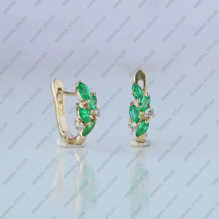 WEDDING JEWELRY ! Marquise Emerald Gemstone With Lab Grown Diamonds Leaf Hoop Earring. PEREFCT GIFT FOR MOM, SISTER, FRIEND. GIRLFRIEND AND DAUGHTER. Available Gold Color: Yellow Gold, Rose, Gold White Gold. ✦Gemstone: Emerald ✦Shape : Round ✦Color: Green ✦ Weight : 0.28 Ct approx ✦Gemstone: Moissanite ✦Shape : Round ✦Color: Colorless ✦Clarity: VVS ✦Weight  : 0.08 Ct approx ✦Gemstone: Lab Grown Diamond ✦Shape : Round ✦Color: G ✦Clarity: SI ✦Weight  : 0.08 Ct approx ✦SKU: 2100 Metal Type: Solid 9k,14K & 18k Gold ▷ Returns & Exchanges Ring Size : US 7 (Resizable and charge apply above US 8) I understand how important it is to love what you buy! If, for any reason, you are not satisfied with your purchase, I gladly accept returns, exchanges, and cancellations. * Please contact me within 2 wee Gold Huggies, Leaf Earring, Eco Friendly Jewelry, Gold Piece, Rose Gold White, Emerald Gemstone, Earring Jewelry, Jewelry Earrings Hoops, Diamond Cluster