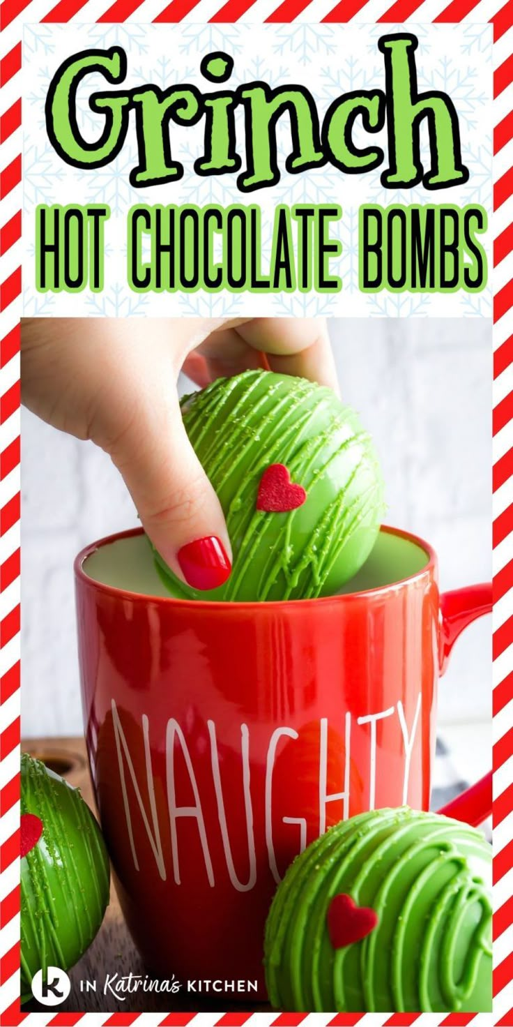 a red mug filled with green chocolate covered donuts