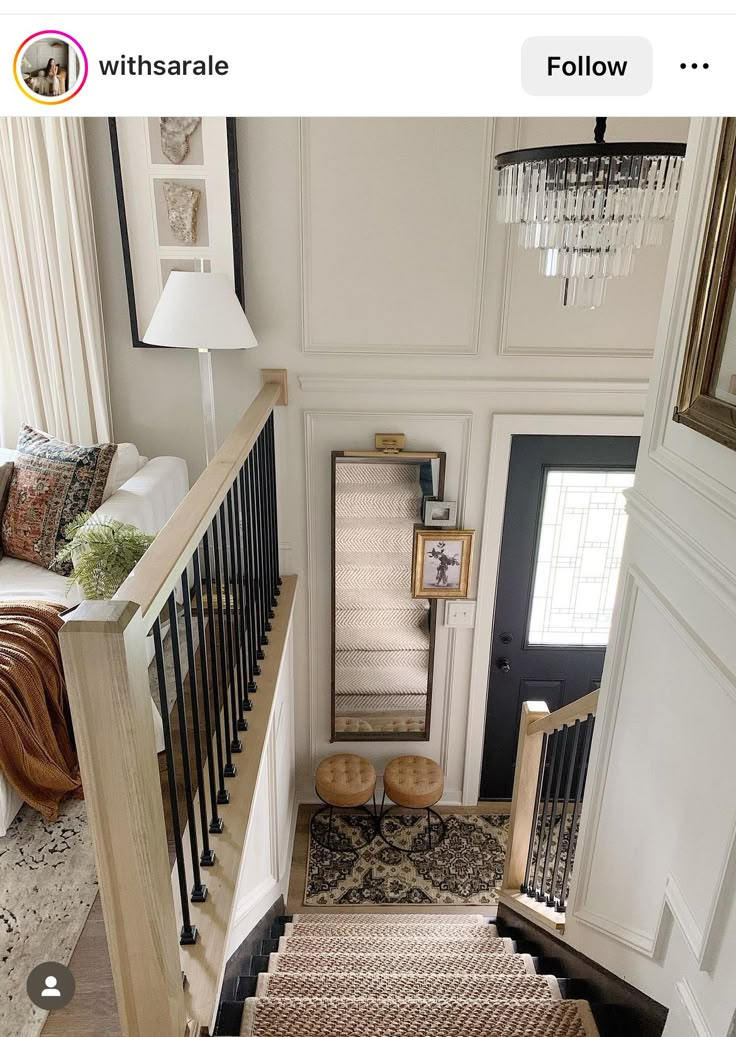 the stairs in this house are made of wood and have been painted white with black trim