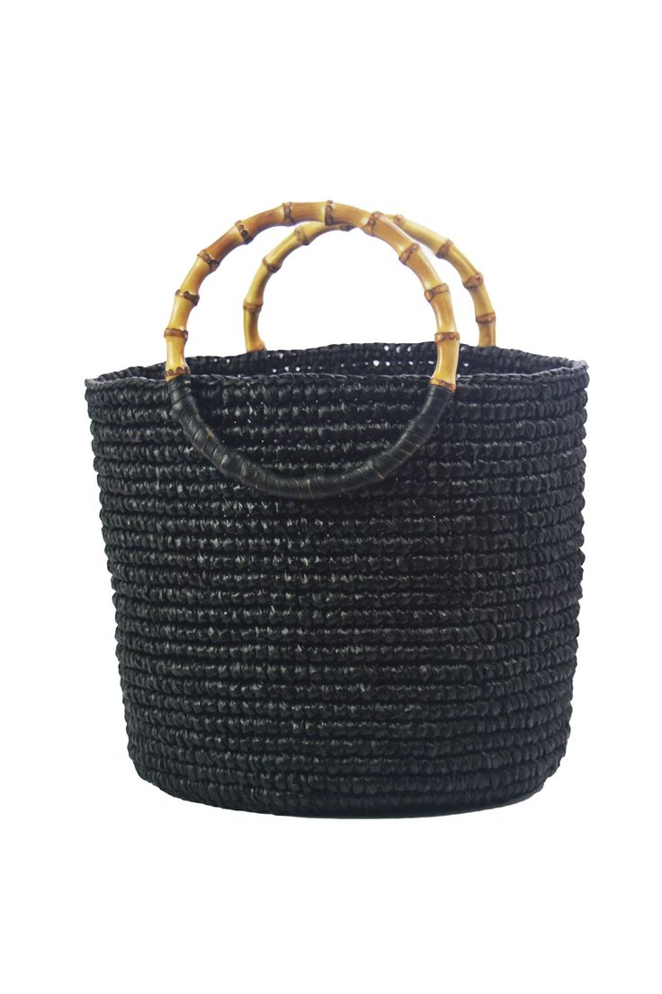 100% Toquilla straw with Bamboo handle.
This material is known for it's quality and beauty. Black Woven Beach Bag Made Of Natural Fiber, Natural Woven Bucket Bag With Round Handle, Natural Straw Bag With Rolled Round Handles, Jute Straw Bucket Bag With Bamboo Handle, Jute Straw Bag With Bamboo Handle In Bucket Shape, Jute Straw Bag With Bamboo Handle And Bucket Shape, Natural Fiber Bucket Bag With Bamboo Handle, Natural Crochet Bag With Bamboo Handle, Natural Crochet Top Handle Bag With Bamboo Handle