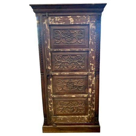 an old wooden cabinet with ornate carvings on the front and bottom panel, against a white background