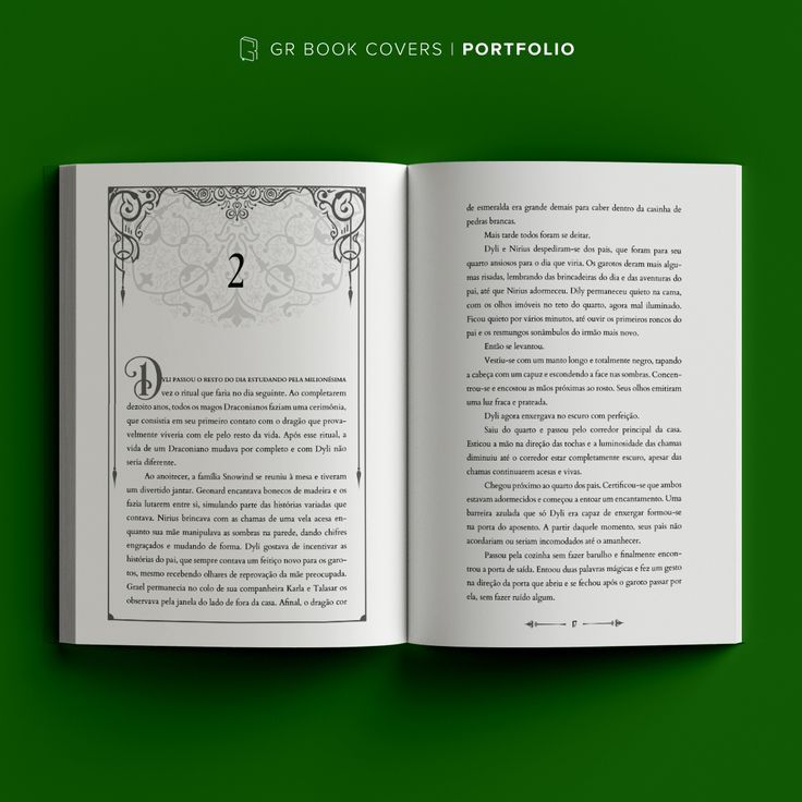 an open book on a green background with the number two in it's center