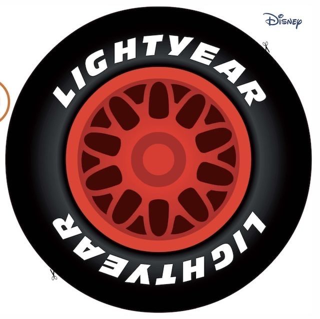 a red wheel with the words lightyear and black tires on it's side