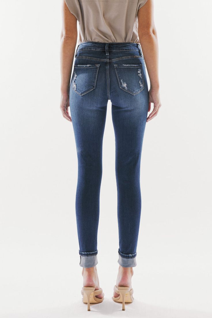 Our Chelsea High Rise Jeans come in a super skinny fit with whiskering, light distress, and a gently faded wash. Sits slightly above the natural waistline as it tapers down the leg and finishes with a folded hem creating a casual design that's perfect for on-the-go days. Made with buttery-soft stretch denim that's flexible and breathable. Features a classic five-pocket design and four-button front closure. 9.5" Rise / 28.5" Inseam 54% Cotton, 34% Rayon, 10% Polyester, 2% Spandex Model in size 25 Dark Wash Style # : KC6192D Stretchiness Level >> Stretch SIZE WAIST HIP 0 / 23 23.5" 30.5" 1 / 24 24.5" 31.5" 3 / 25 25.5" 32.5" 5 / 26 26.5" 33.5" 7 / 27 27.5" 34.5" 9 / 28 29" 36" 11 / 29 30.5" 37.5" 13 / 30 32" 39" 15 / 31 33.5" 40.5" Super Dark, Casual Design, High Rise Jeans, Pocket Design, Favorite Jeans, Stretch Denim, Chelsea, High Rise, Chelsea Fc