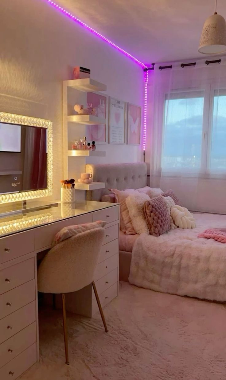 a bedroom with a bed, desk and mirror in it's center area is lit up by purple lights