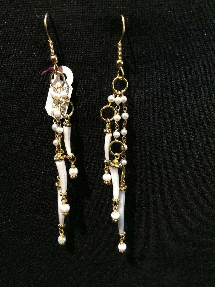 "Pearl Droplet Earrings Artist: Teresa Bradford-Cole Length with gold-filled ear wire: 4\" Pearls, Scaphopoda Shell, with gold-filled spacers and wire. Gorgeous earrings, light to wear, and have so much movement! Yes ~ along with basic simplicity ~ It's all about you You deserve to know about my fabulous Treasure chest HeartbeatHandmade and Big Sur Jade Treasures both (Etsy sites) Tribal Jewelry, Statement Piece Jewelry, Art to Wear Jewelry, Fantastic Fine Leather Beaded Handbags, an array of tr Gold Dangling Bead Jewelry, Gold Dangling Bead Earrings, Gold Dangle Jewelry With Dangling Beads, Gold Dangle Jewelry With Beads, Gold Beaded Dangle Earrings With French Hook, White Metal Jewelry With Dangling Beads, White Dangle Earrings With French Hook, Brass Dangle Jewelry With Dangling Beads, White Metal Drop Earrings