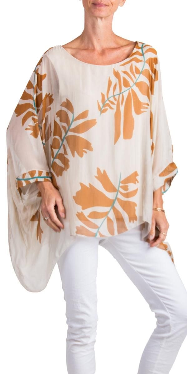 100% Silk Kaftan Style Blouse with Large Leaf Print. Features 3/4 Length Sleeves and a Wavy Bottom. Exterior: 100% Silk Interior: 95% Viscose, 5% Elastic Fits Sizes XS- XL Made in Italy Vacation Printed Blouse With 3/4 Sleeves, Bohemian Silk Blouse For Beach, Floral Print Beach Blouse With 3/4 Sleeves, Beach Blouse With Floral Print And 3/4 Sleeves, Beach Blouse With 3/4 Sleeves And Floral Print, Summer 3/4 Sleeve Blouse For Beach, Silk Floral Print Beach Top, Silk Floral Print Top For Beach, Summer Blouse For Beach With 3/4 Sleeves