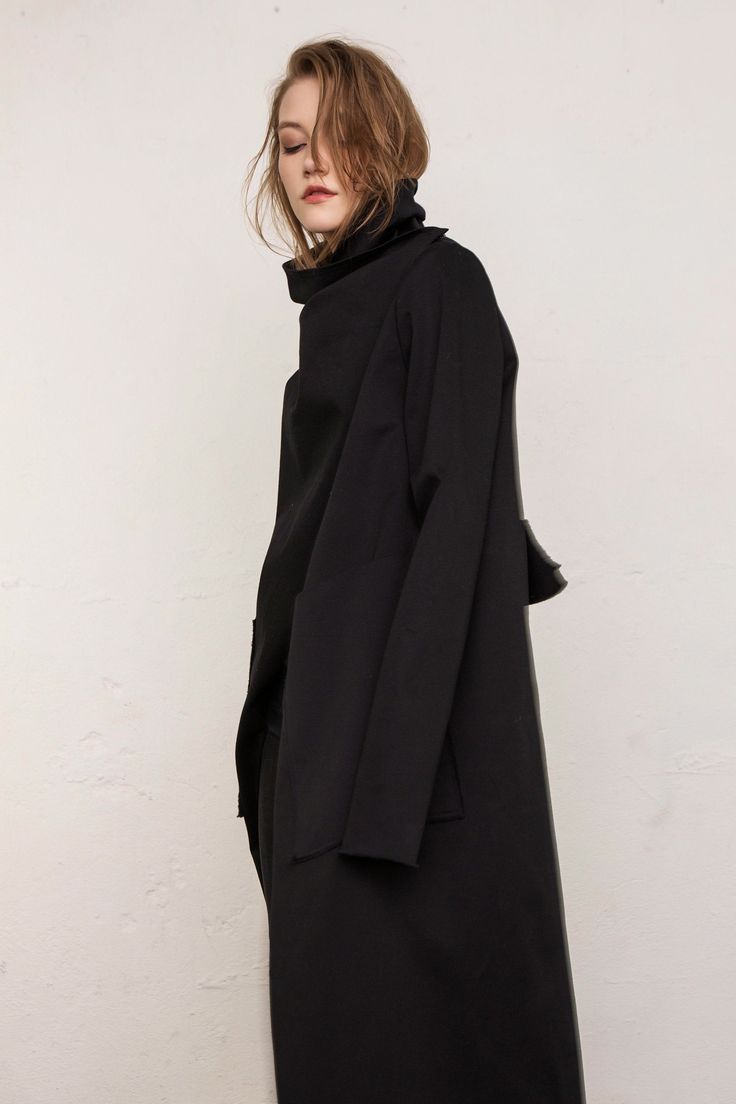 Coat women / Long coat / Jacket / Minimalist / Oversized coat / Asymmetrical coat / Elegant coat /Trench coat / Black coat Composition 80% Wool 20% Polyester Model is 175cm height Size guide XS Bust: 82-85cm, Waist: 62-66cm, Hips: 86-90cm S Bust: 86-89cm, Waist: 66-70cm, Hips: 90-94cm M Bust: 90-93cm, Waist: 70-74cm, Hips: 94-98cm L Bust: 94-97cm, Waist: 74-80cm, Hips: 99-105cm XL Bust: 98-103cm, Waist: 80-86cm, Hips: 106-112cm XS: EU34 / US 2 / UK6 / FR 34 S: EU 36 / US 4 / UK8 / FR 36 M: EU 38 Oversized Solid Color Cape Outerwear, Chic Asymmetrical Winter Blazer, Modern Winter Cape Outerwear, Modern Asymmetrical Outerwear For Fall, Oversized Wool Cape Coat For Fall, Asymmetrical Winter Office Outerwear, Long Coat For Layering, Solid Long Coat For Layering, Solid Cape Outerwear For Work