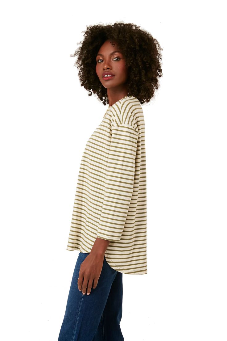 A sporty swap for your go-to t-shirts, the Olive Striped Knit Popover adds a little something extra to your dressed down days. Cream and green hues create a vintage feel while the modern stretch knit fabric and swing shape guarantees this to be in your wardrobe for years to come. We are pairing this with sneakers, baseball caps and sunnies for low key days and adding a crisp button up underneath for a fun play on layering for brunch with friends. Cream and olive striped Swing shape Crew neckline Brunch With Friends, Green Hues, Striped Knit, Dressed Down, Baseball Caps, Fabric Material, Crew Neckline, Sunnies, Baseball Cap