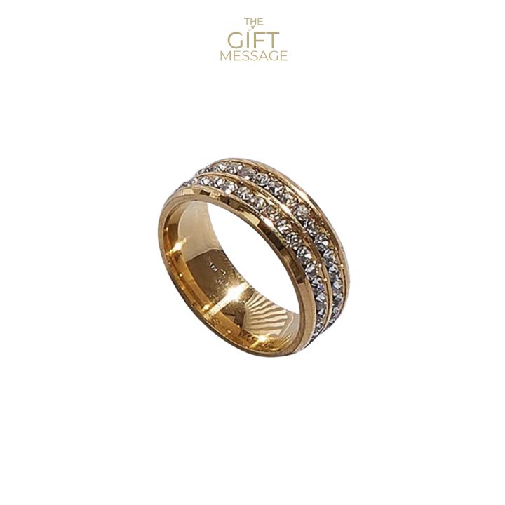 a gold ring with three rows of diamonds