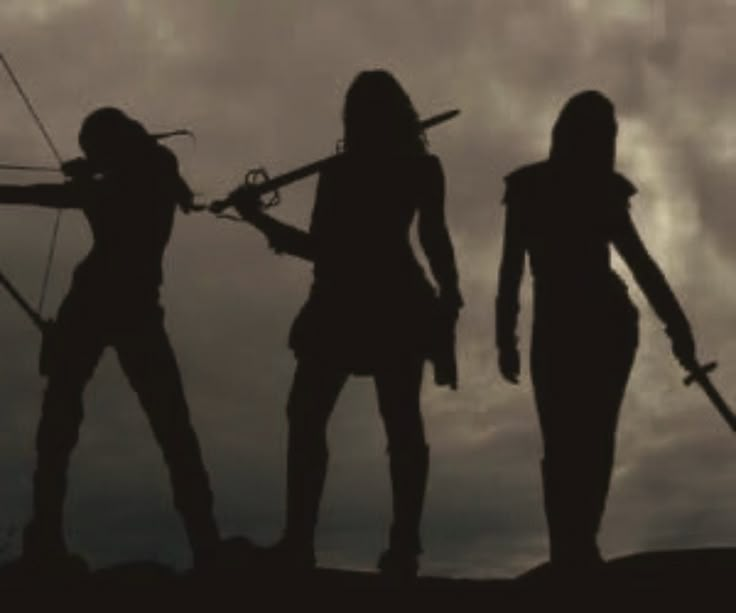 three women with bows and arrows are silhouetted against a cloudy sky