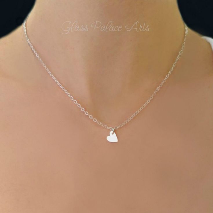 "Mother daughter heart necklace set ~ 100% Sterling Silver Dainty and sweet, these necklaces make for the perfect keepsake. These adorable handmade heart necklaces honor the love between mother and daughter. *Purchase individually, as a set, or add additional tiny heart necklaces for multiple daughters - Tiny sterling silver heart measures 8mm - Heart disk cutout for mother measures about 1/2 inch - Chain is a sparkly sterling silver chain - Chain lengths shown at 16\" & 18\" - See length ch Delicate Double Heart Jewelry As Gift, Cute Everyday Heart Pendant Jewelry, Simple Necklace With Heart Charm As A Gift, Cute Silver Charm Necklace For Valentine's Day, Delicate Tiny Heart Charm Necklaces, Cute Silver Charm Necklace With Heart Charm, Cute Silver Heart Necklace With Charm, Cute Heart Pendant Jewelry For Mother's Day, Tiny Heart Necklace For Valentine's Day Gift