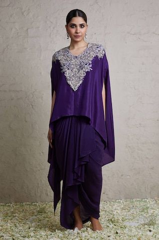 Dark aubergine kaftan with dori, thread, pearl embroidery in floral pattern on neckline. Paired with dhoti skirt. - Aza Fashions Elegant Kurta With Zari Work And Cape Sleeves, Traditional Embroidered Pre-draped Saree With Cape Sleeves, Elegant Purple Pre-draped Saree, Traditional Purple Silk Kaftan, Elegant Embroidered Kurta With Cape Sleeves, Elegant Designer Kaftan With Floral Embroidery, Elegant Kaftan With Floral Embroidery For Diwali, Elegant Floral Embroidered Kaftan For Diwali, Festive Silk Purple Kaftan