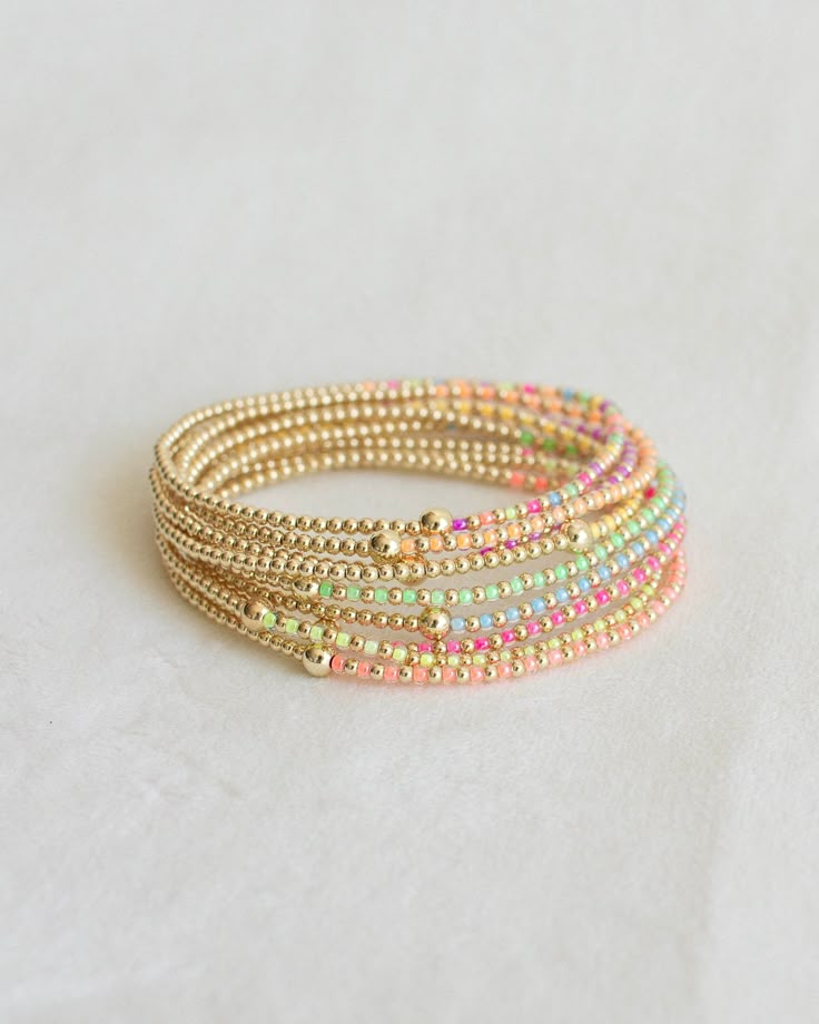 ❖Luna❖ ‣ This listing is for a single bracelet. ‣Luna bracelet features: * 2mm Seed Beads * 2mm 14k Gold Filled Beads * 1-4m 14k Gold Filled Bead Julisa Bracelets Feature:  ‣ Tight/Sturdy elastic, pre-stretched to prevent bracelet from stretching out ‣ Sizing according to wrist size ‣Sizing Tips:  Please measure your wrist for the best fit!  *Using a soft tape measure/string, measure around your wrist, above the wrist bone *Add length according to your desired fit:       * 0" - fitted, snug      * .25" - slight movement      * .5" -  relaxed      * .75"- loose      * 1" - extra loose *Please message us if you need any help with sizing!  ------- ‣Each bracelet is made to order ‣We hand-bead each and every bracelet, please allow for slight variations ‣Your order will ship in a custom jewelry Bead Bracelet Ideas Color Combinations, Pink And Gold Beaded Bracelet, Fun Pink Beaded Bracelets, Gold Beaded Bracelet With Colorful Beads, Pink Bracelets With Colorful Beads, Beaded Bracelets Diy Ideas, Enewton Bracelet Diy, Beaded Pink Gold Bracelets, Cute Bracelet