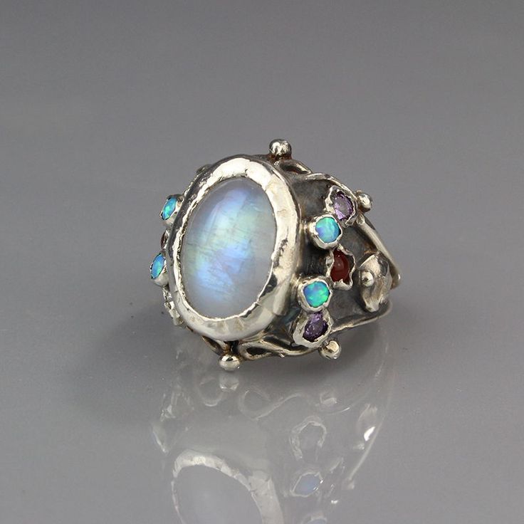 Silver moonstone queen ring Handmade Moonstone Open Opal Ring, Unique Cabochon Moonstone Ring, Unique White Multi-stone Moonstone Ring, Unique Opal Ring With Moonstone, Spiritual Multi-stone Moonstone Ring, Oval Moonstone Ring With Stones, Handmade Opal Open Ring, Unique Open Moonstone Ring With Cabochon Cut, Moonstone Multi-stone Opal Ring As Gift