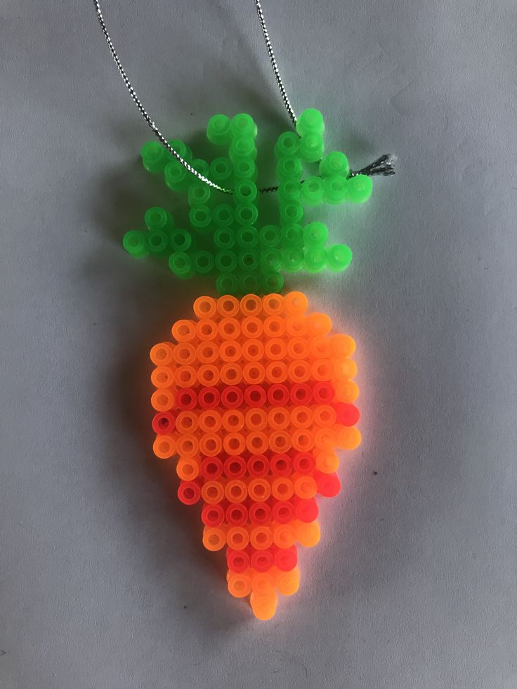 an orange and green carrot made out of legos