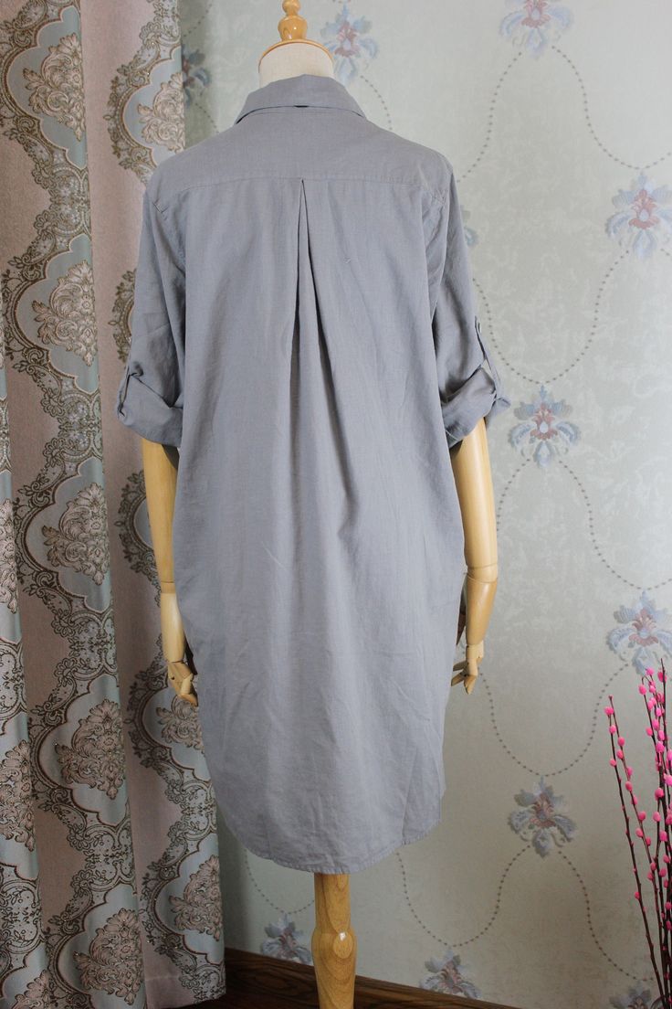 "【Fabric】 Cotton 【Color】 gray 【Size】 Shoulder width 42cm/ 16.4 sleeve length 60cm / 23.4\" Cuff circumference 24cm/ 9 Bust 108cm / 42\" Waist circumference 122cm/ 48 Length 90cm/ 35\" Washing & Care instructions: -Hand wash or gently machine washable do not tumble dry -Gentle wash cycle (40oC) -If you feel like ironing (although should not be necessary) , do it with steam or while the dress is still slightly wet -Do not bleach If you like this dress, perhaps you will also like other dresses Gray Relaxed Fit V-neck Shirt, Gray Long Sleeve Shirt For Spring, Solid Color Long Sleeve Shirt With Rolled Sleeves, Casual Long Sleeve Shirt Dress With Rolled Sleeves, Oversized Shirt Dress With Roll-up Sleeves, Cotton Long Sleeve Shift Shirt Dress, Long Sleeve Gray Shirt For Summer, Gray Long Sleeve Summer Shirt, Summer Long Sleeve Gray Shirt