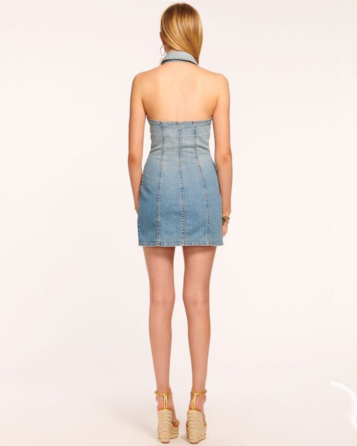 Whether worn for a country concert or dinner in the city, the Susanna makes a compelling case for denim. This sleeveless dress with collar features a flattering button down design, a contemporary touch that enhances the curve-loving silhouette.Size & Fit – This style runs small, we suggest sizing up. – Model is Wearing Size 25 – Model is 5'9"– Length: 33.5", based on a size 2 Size Guide Details & Care – Collared halter neckline – Sleeveless – Button down silhouette – Pockets– Dry Clean or Hand W Fitted Sleeveless Denim Dress For Casual Wear, Chic Sleeveless Denim Dress For Casual Wear, Sleeveless Denim Dress For Casual Wear, Fitted Sleeveless Denim Dress For Night Out, Chic Medium Wash Denim Dress For Casual Wear, Chic Denim Dress For Casual Wear, Chic Denim Dress For Dress Down Occasions, Fitted Denim Summer Dress For Day Out, Chic Washed Denim Mini Dress