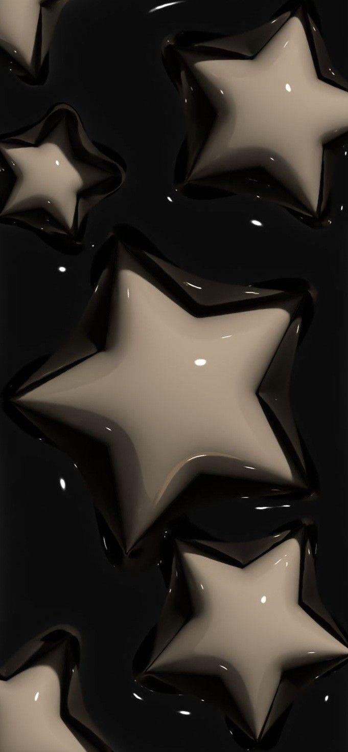 several shiny stars on a black background with some white and brown colors in the middle