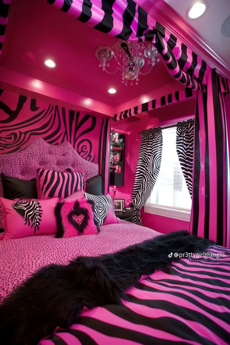 a pink and black bedroom with zebra print bedding, chandelier, window curtains