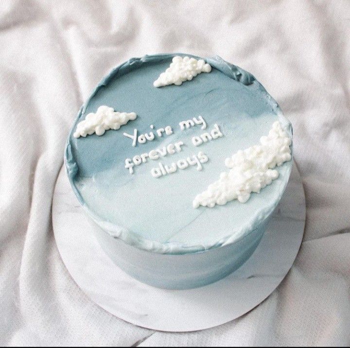 a blue cake with white frosting that says you're my forever and always