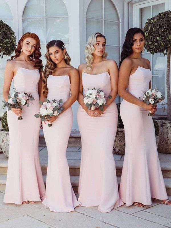 the bridesmaids are all wearing pink dresses and holding bouquets in their hands