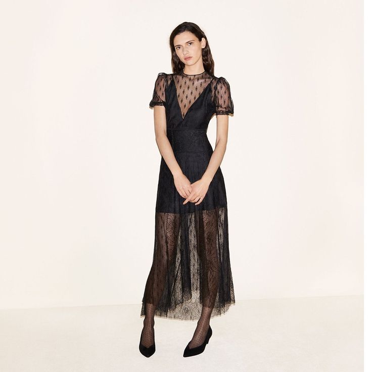 Worn Once All-Over Black Lace Midi Dress With Short Puff Sleeves. Round Neck And Fitted Waist With A Flared Skirt. Semi-Sheer With A Partial Slip Lining. Concealed Zip Fastening At Side. 90% Nylon, 10% Viscose; 100% Nylon; 48% Acetate, 32% Viscose, 20% Cotton Sheer Short Sleeve Evening Midi Dress, Evening Sheer Short Sleeve Midi Dress, Short Sleeve Sheer Midi Evening Dress, Black Lace Maxi Dress With Short Sleeves, Black Lace Short Sleeve Maxi Dress, Cocktail Maxi Dress With Lace Trim, Knee-length Evening Dress With Lace Trim, Cocktail Short Sleeve Dress With Lace Trim, Short Sleeve Cocktail Dress With Lace Trim