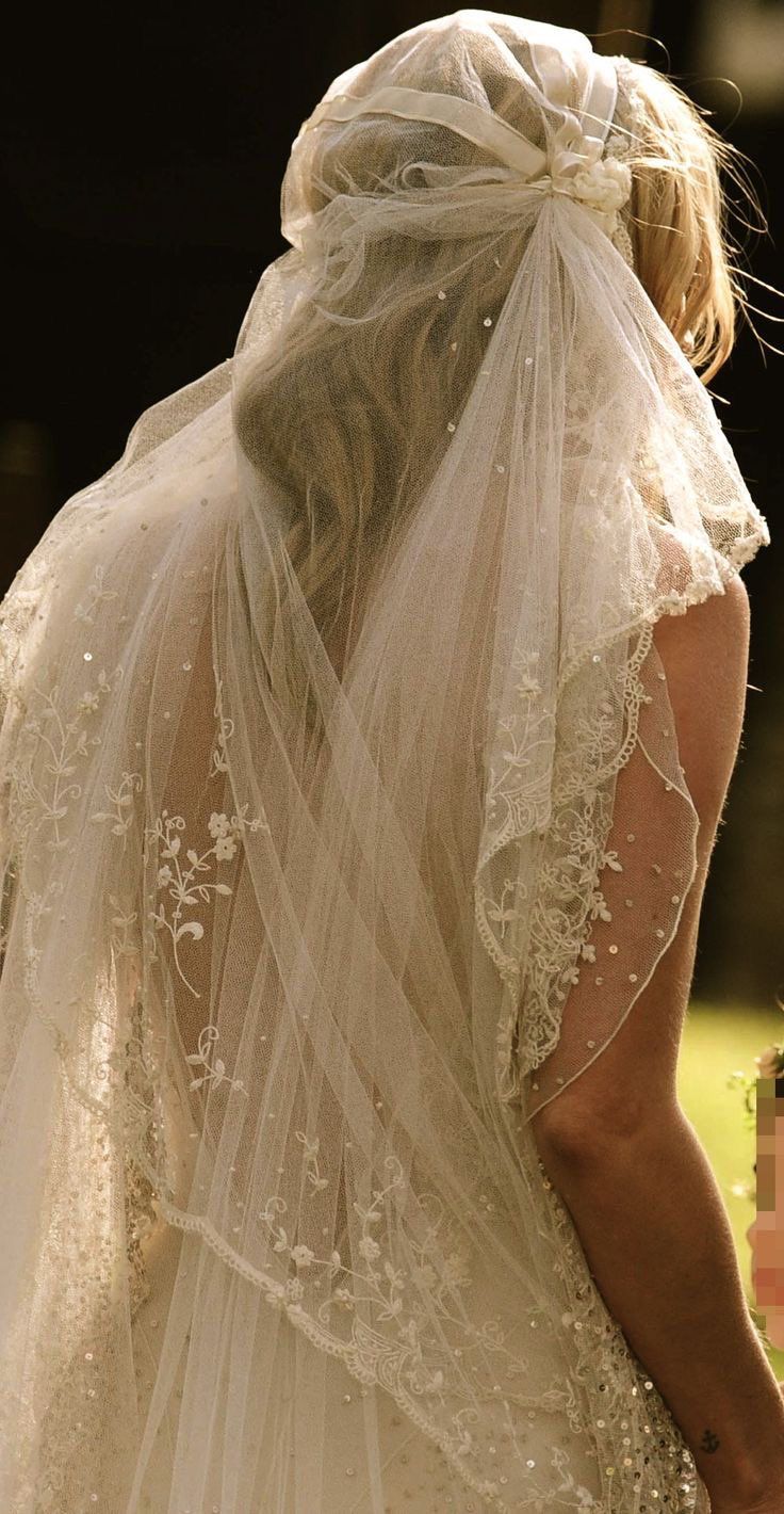 the back of a bride's veil as she walks