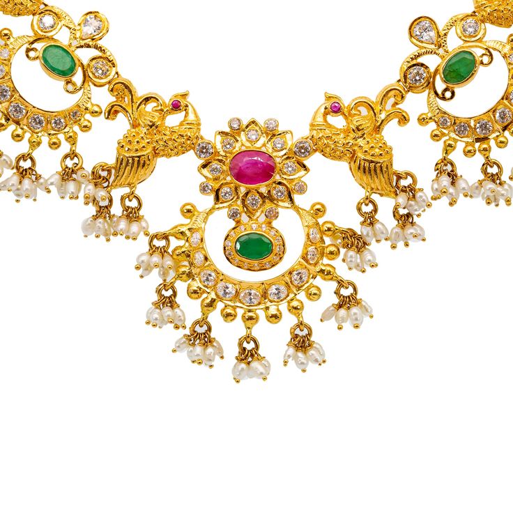 Our 22K Yellow Gold Guddapulsula Jewelry Set for women is perfect to wear for cultural ceremonies and other special occasions. The ultra feminine design of the necklace and matching chandbali earrings decorated with shimmering emeralds, rubies, pearls, and pearls is extremely flattering when paired with traditional wear or other formal looks. Features• 22K Yellow Gold.• Emeralds. • Rubies.• Pearls.• Cubic Zirconia.Specifications• Minimum Necklace Width - 2 millimeters • Maximum Necklace Width - Traditional Yellow Jewelry With 108 Beads, Traditional Yellow Gold Emerald Necklace For Festivals, Traditional Yellow Jewelry With Dangling Beads, Yellow Gold Bollywood Pearl Drop Jewelry, Traditional 22k Yellow Gold Pearl Necklace, Chandbali Earrings, Ultra Feminine, Gold Bead Necklace, Traditional Wear