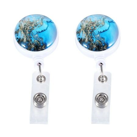 pair of earrings with blue and white swirls on the front, in clear acrylic