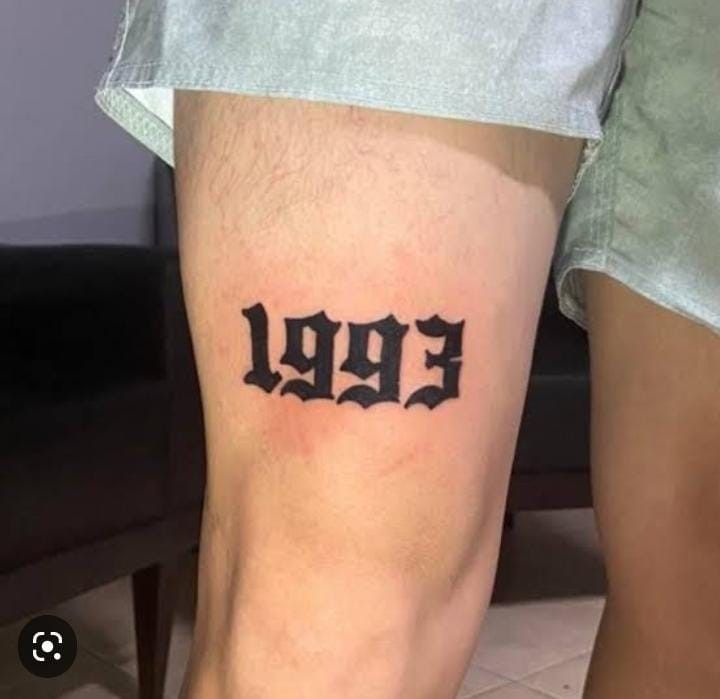 a man with a tattoo on his leg that says eppi in black ink