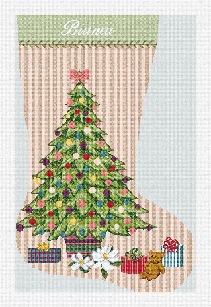 a cross stitch christmas stocking with a tree and presents