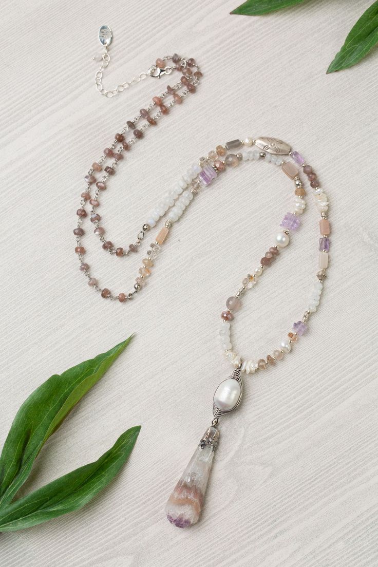 Sterling Silver (lead and nickel free) Rainbow Moonstone, Pearl, Chocolate Moonstone, Amethyst 29-31", adjustable with sterling silver lobster claw clasp We hand select our natural materials, thus there may be slight variations in color and/or size that will not detract from the overall aesthetic Our unique handcrafted designer jewelry for women is made in America, with each design created individually in our personal design studio in Floyd VA USA Floyd Va, Silver Gold Necklace, Silver Gold Earrings, Simple Collage, Rainbow Pearl, Pearl Design, Amethyst Jewelry, Amethyst Necklace, Gold Collection